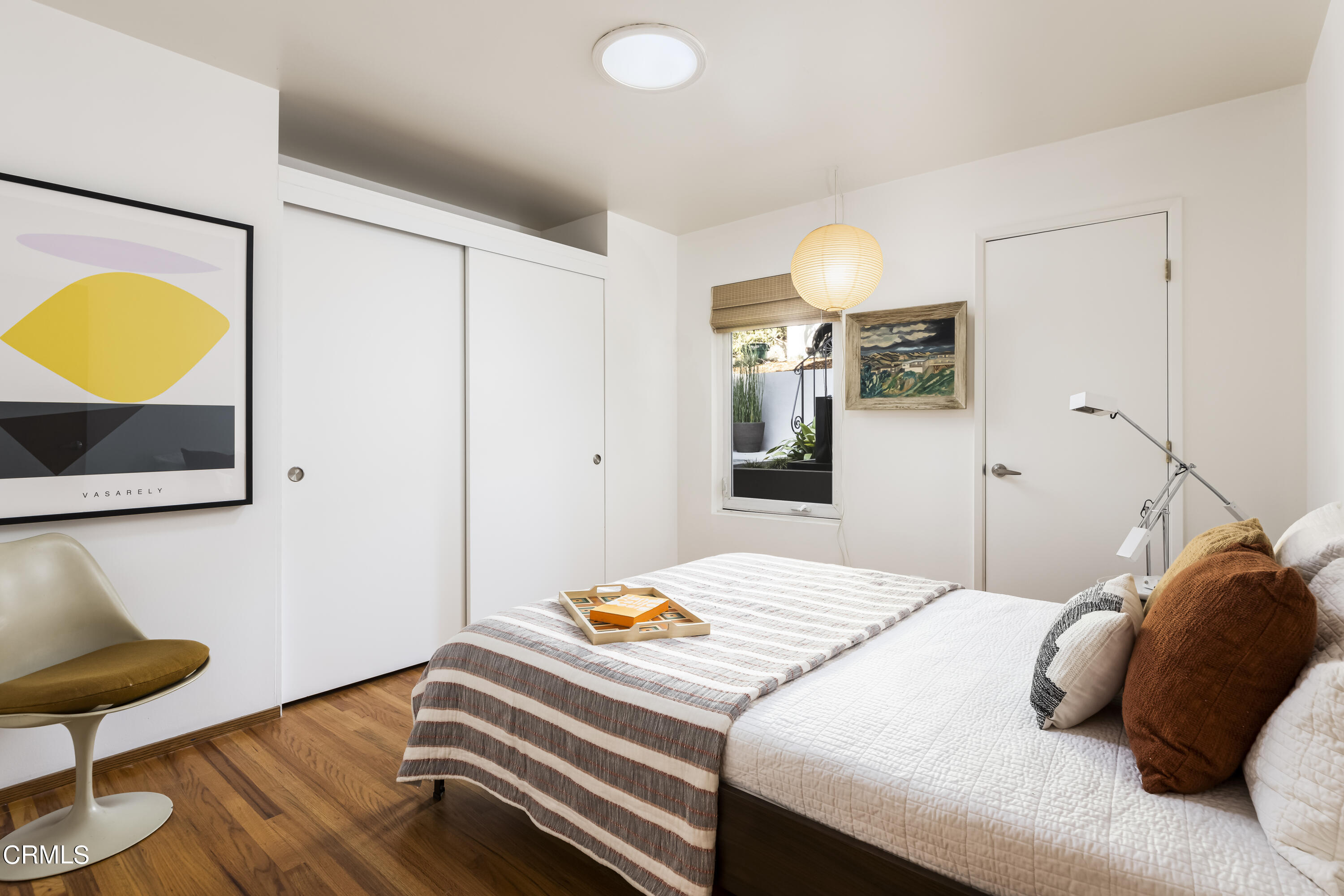 329 Redwood Drive Pasadena, CA 91105 - Photo 20 of 32 a bedroom with a bed and a lamp