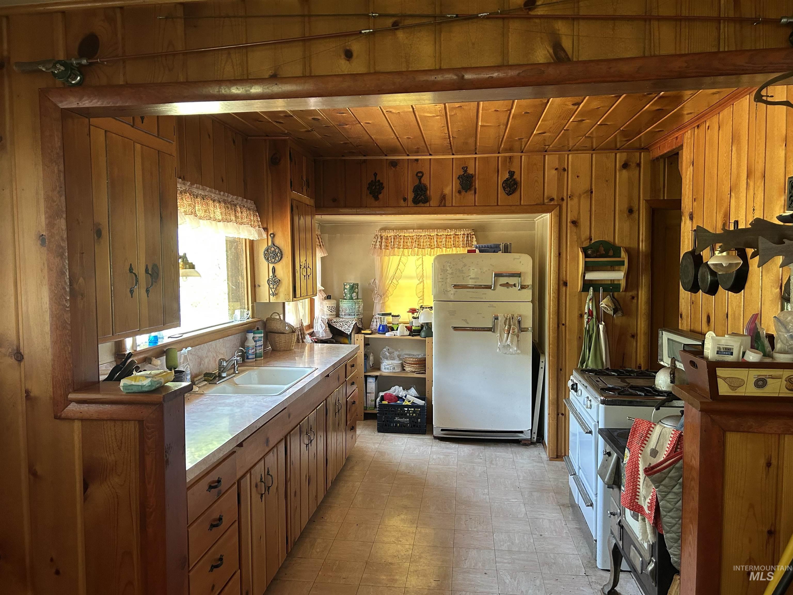 44 Long Creek Road Lowman, ID 83637 - Photo 15 of 42 Tiled flooring accompanies a built-in wooden shelving unit