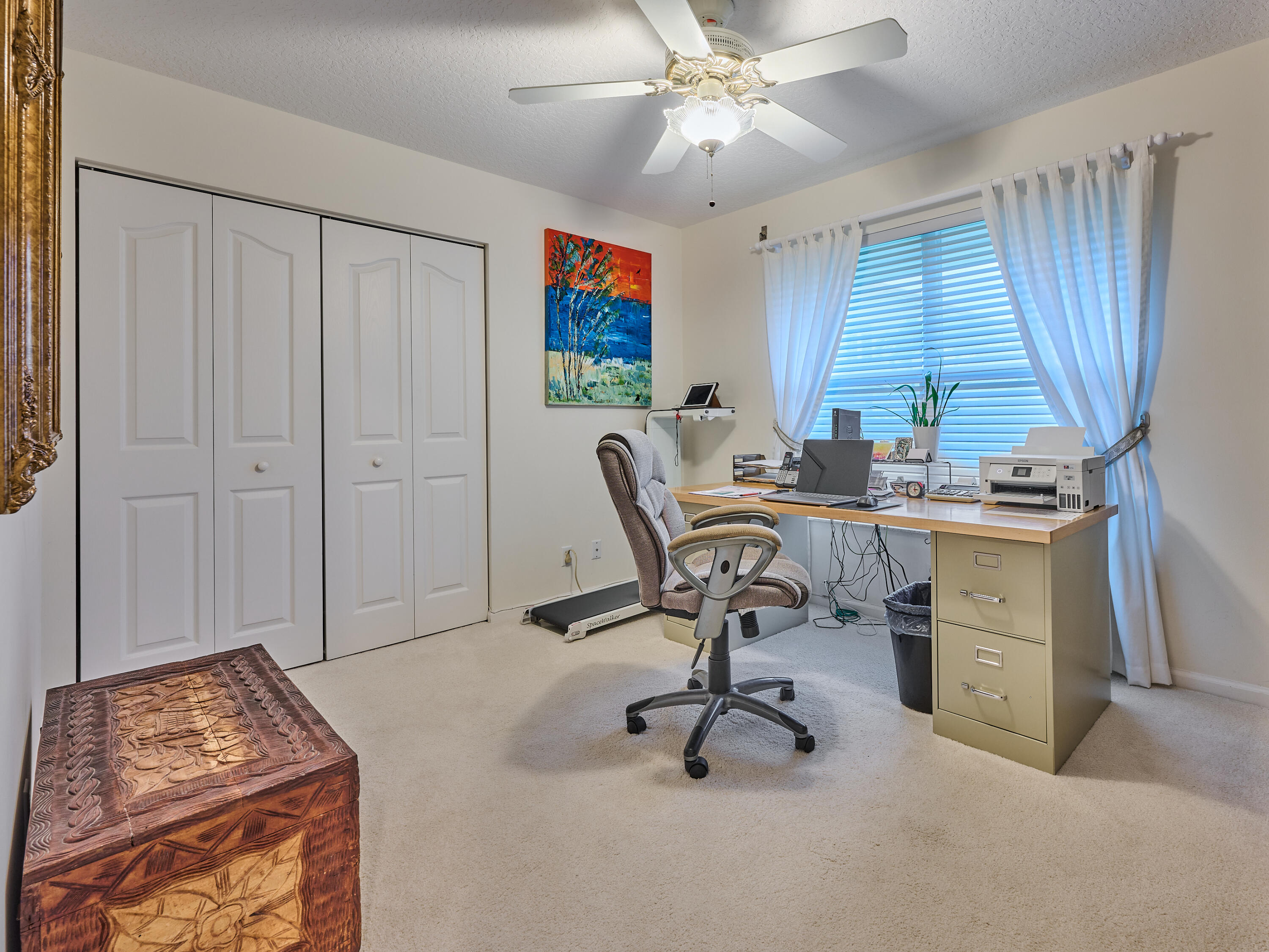 471 Neptune Road Juno Beach, FL 33408 - Photo 5 of 13 a view of a workspace with furniture and a window