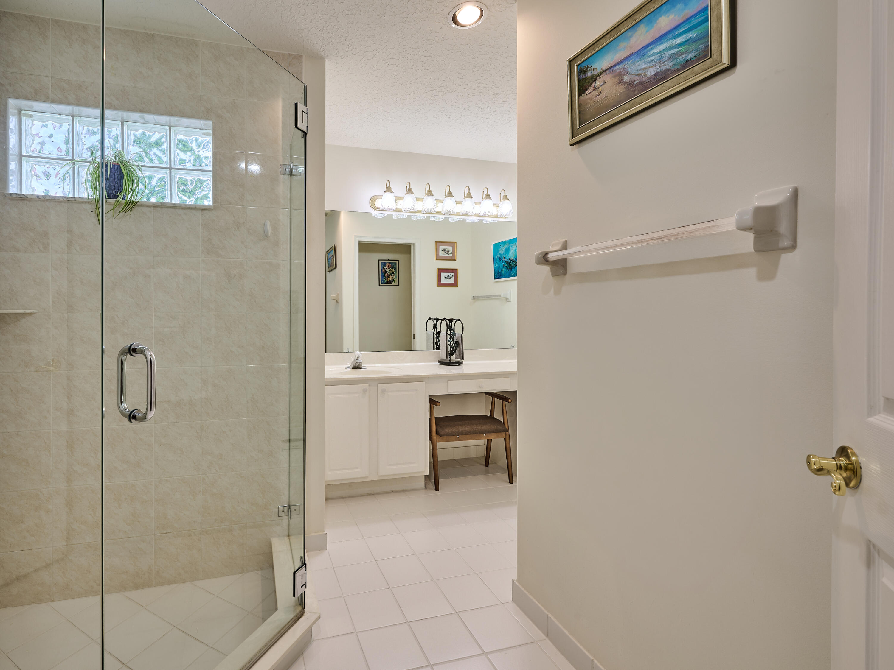 471 Neptune Road Juno Beach, FL 33408 - Photo 6 of 13 a bathroom with a sink and a mirror