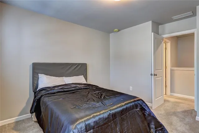 a bedroom with a bed and a cabinets