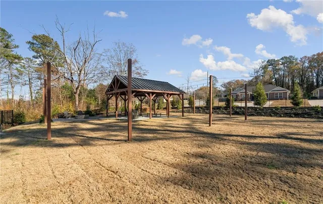 a view of a patio with a table and chairs