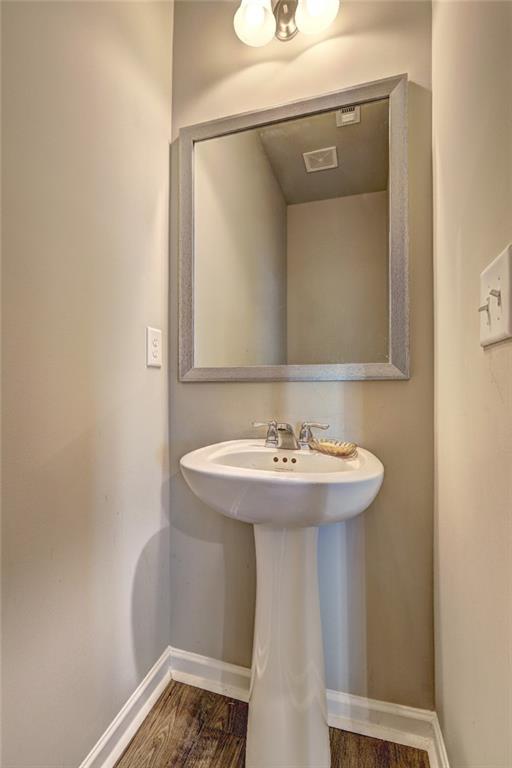 1123 Elyse Lane Mableton, GA 30126 - Photo 7 of 29 a bathroom with a sink a mirror and vanity