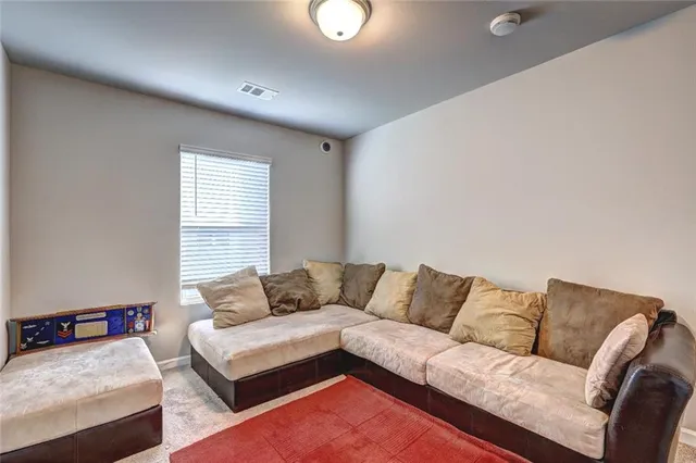 a living room with furniture and a couch