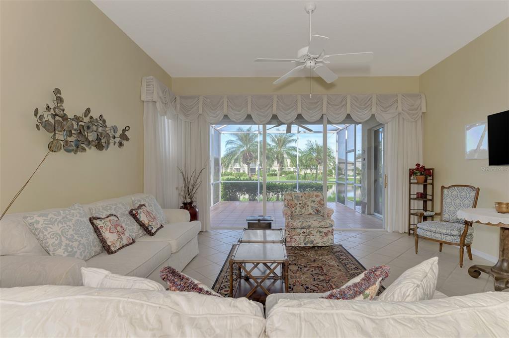 3413 Pennyroyal Road Port Charlotte, FL 33953 - Photo 12 of 88 a bed sitting in a bedroom next to a window