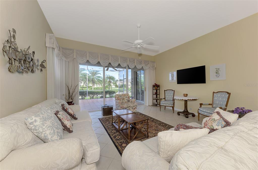 3413 Pennyroyal Road Port Charlotte, FL 33953 - Photo 13 of 88 a living room with furniture window and a flat screen tv