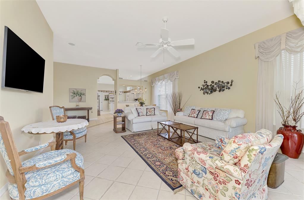 3413 Pennyroyal Road Port Charlotte, FL 33953 - Photo 14 of 88 a living room with furniture and a flat screen tv