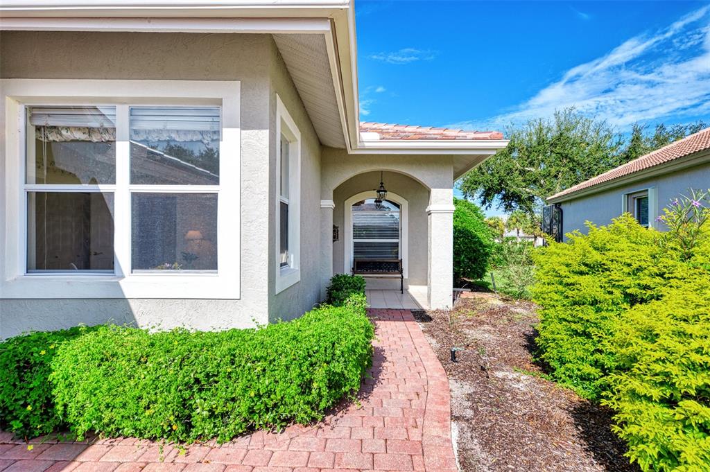 3413 Pennyroyal Road Port Charlotte, FL 33953 - Photo 3 of 88 a front view of a house with a porch