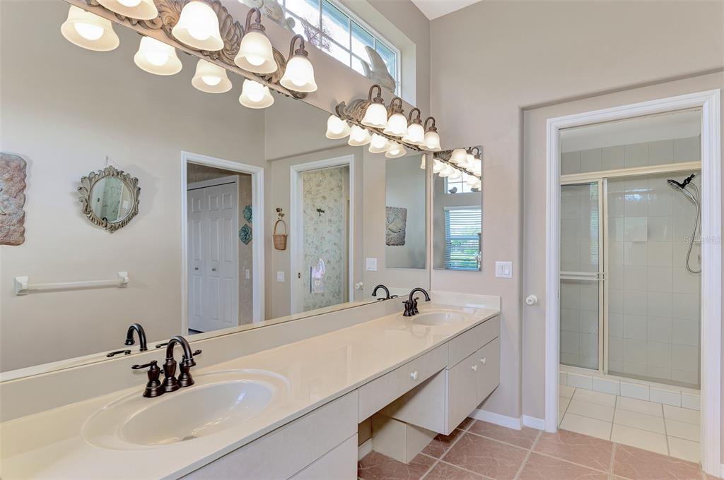 3413 Pennyroyal Road Port Charlotte, FL 33953 - Photo 34 of 88 a bathroom with a tub a sink and mirror