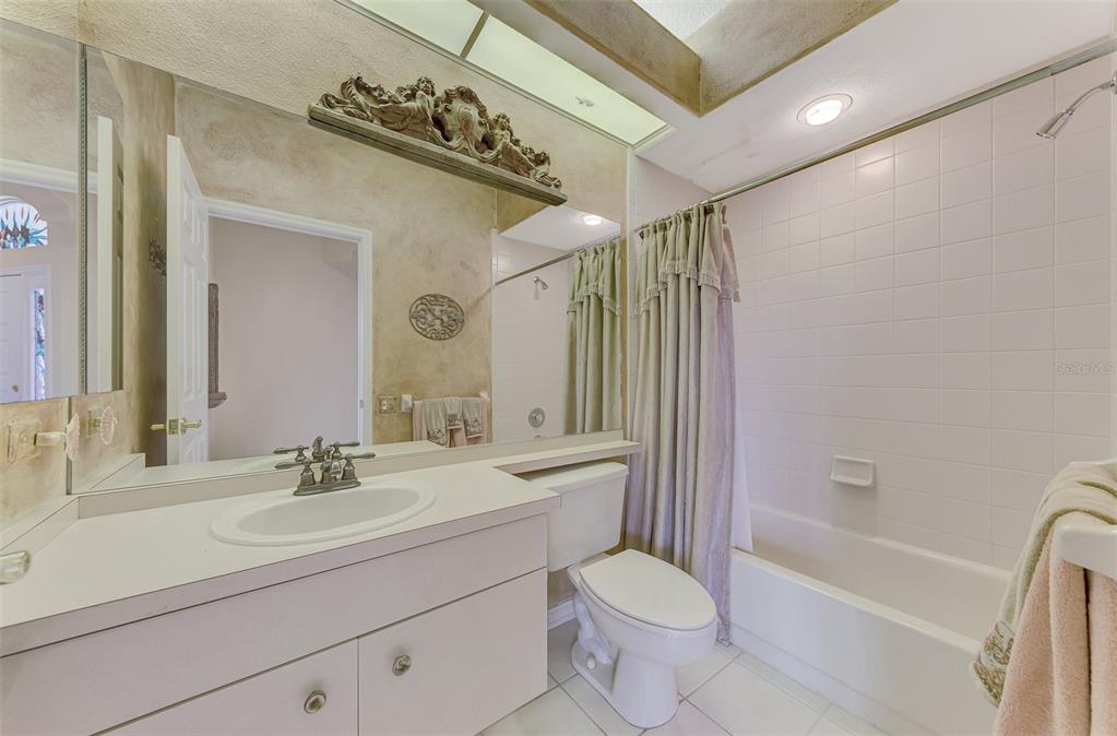 3413 Pennyroyal Road Port Charlotte, FL 33953 - Photo 38 of 88 a bathroom with a sink a toilet and shower