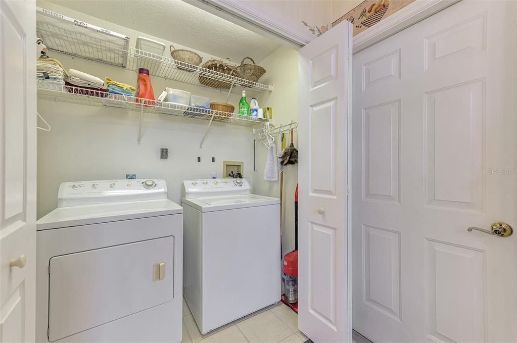 3413 Pennyroyal Road Port Charlotte, FL 33953 - Photo 41 of 88 a utility room with dryer and washer