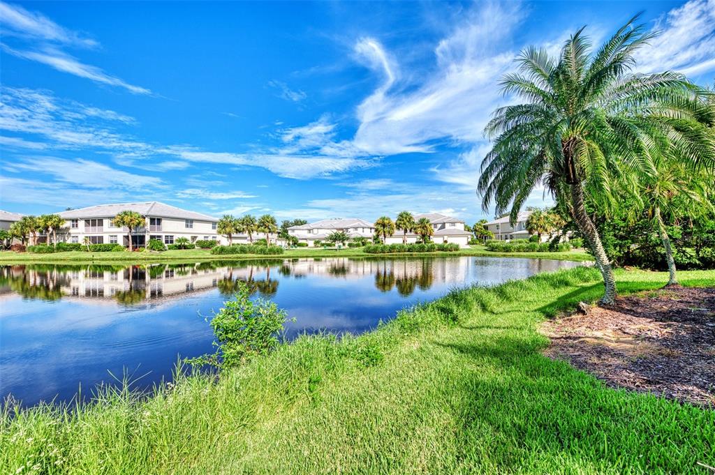 3413 Pennyroyal Road Port Charlotte, FL 33953 - Photo 50 of 88 a view of a lake with a yard