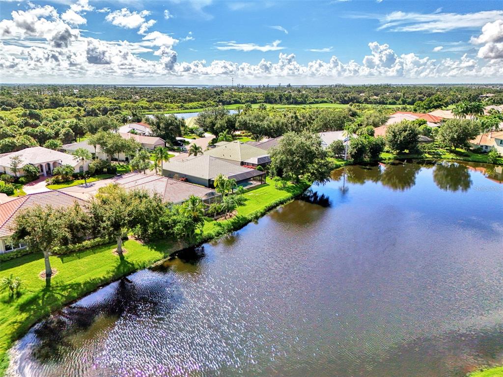 3413 Pennyroyal Road Port Charlotte, FL 33953 - Photo 54 of 88 a view of a lake with houses in the back