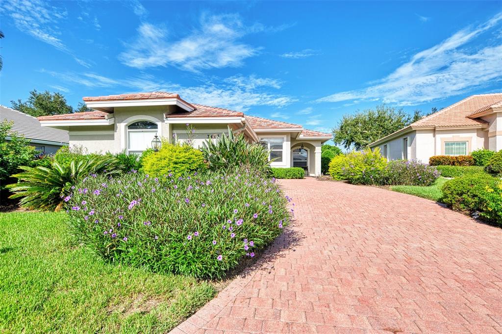 3413 Pennyroyal Road Port Charlotte, FL 33953 - Photo 64 of 88 a front view of a house with a yard