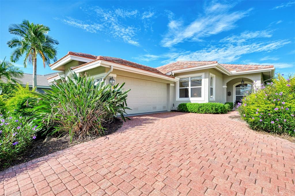 3413 Pennyroyal Road Port Charlotte, FL 33953 - Photo 65 of 88 a view of a house with a yard and potted plants