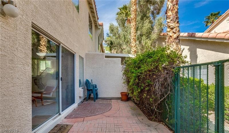 5272 Island Chain Road Las Vegas, NV 89118 - Photo 5 of 31 A private patio, perfect for relaxing or entertaining, is accessed via sliding glass doors.
