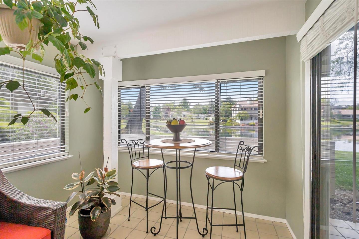 8387 Riesling Way San Jose, CA 95135 - Photo 15 of 52 a dining room with furniture and a potted plant