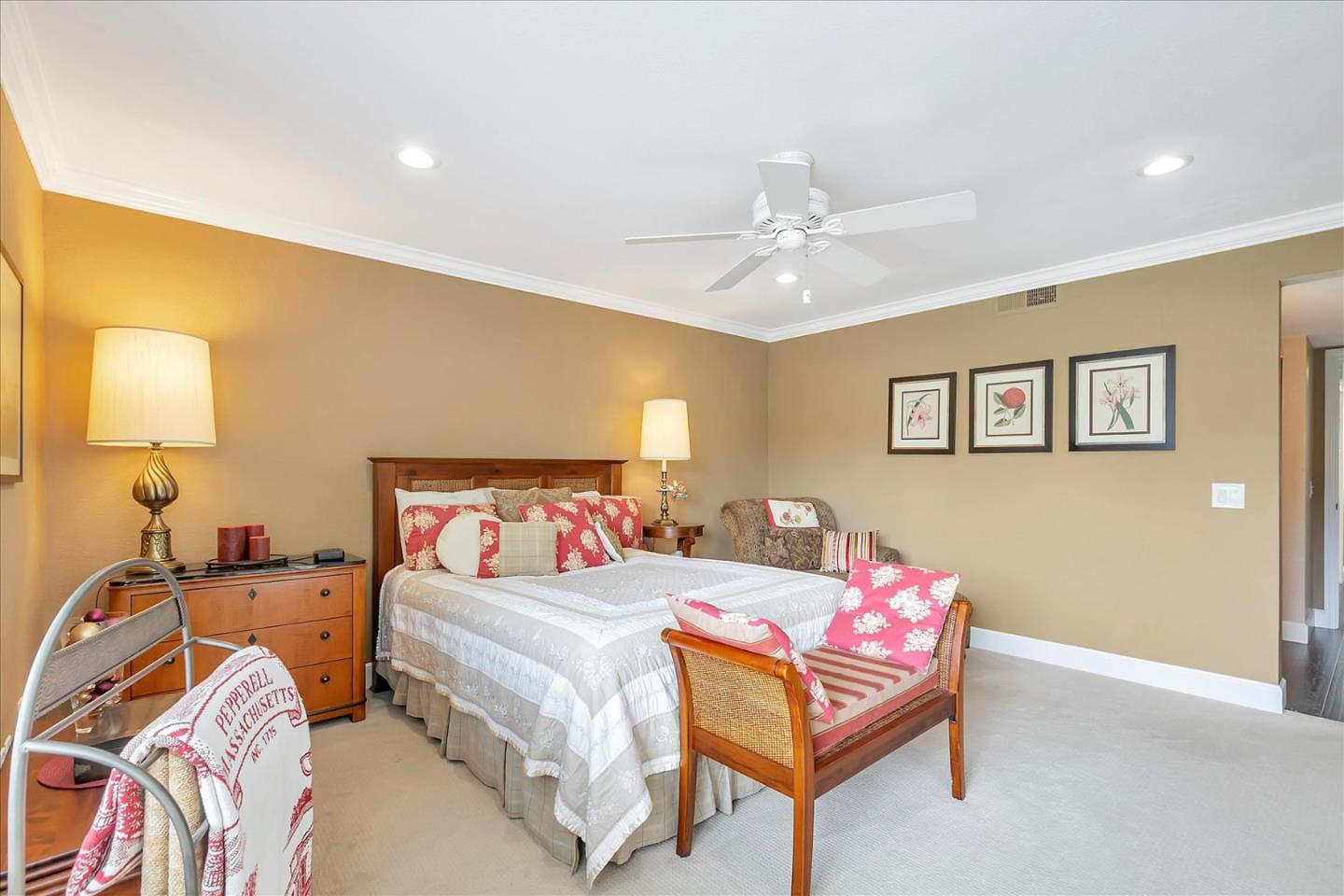 8387 Riesling Way San Jose, CA 95135 - Photo 18 of 52 a bedroom with a bed and a chandelier