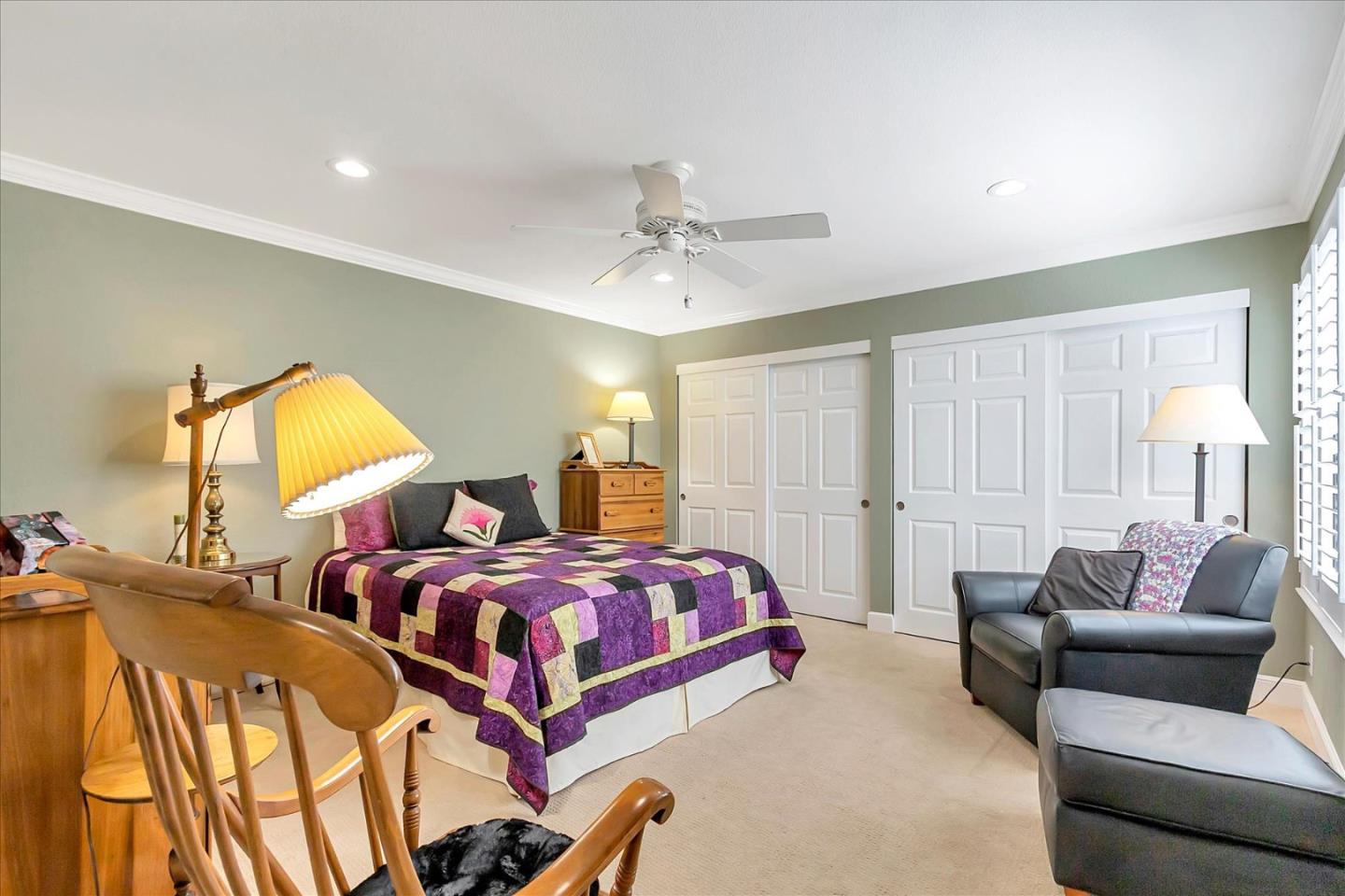 8387 Riesling Way San Jose, CA 95135 - Photo 19 of 52 a bedroom with two beds and a chandelier