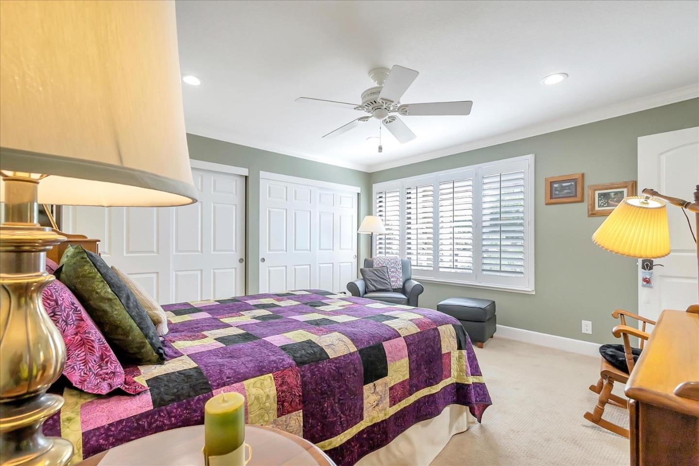 8387 Riesling Way San Jose, CA 95135 - Photo 20 of 52 a bedroom with a bed a chandelier and a window