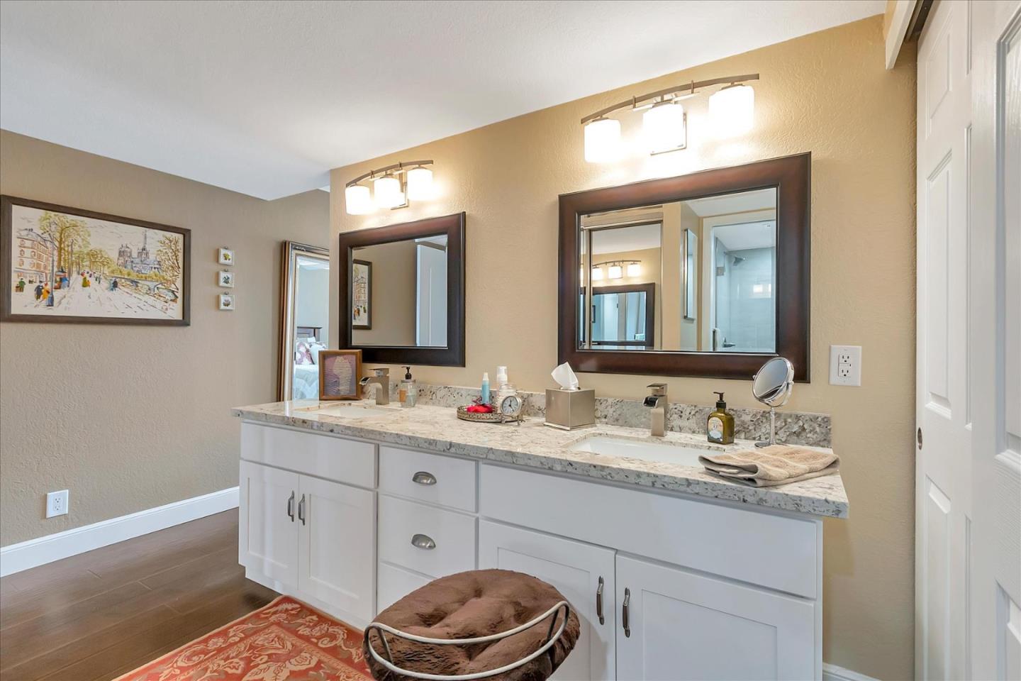 8387 Riesling Way San Jose, CA 95135 - Photo 23 of 52 a bathroom with a double vanity sink and a mirror