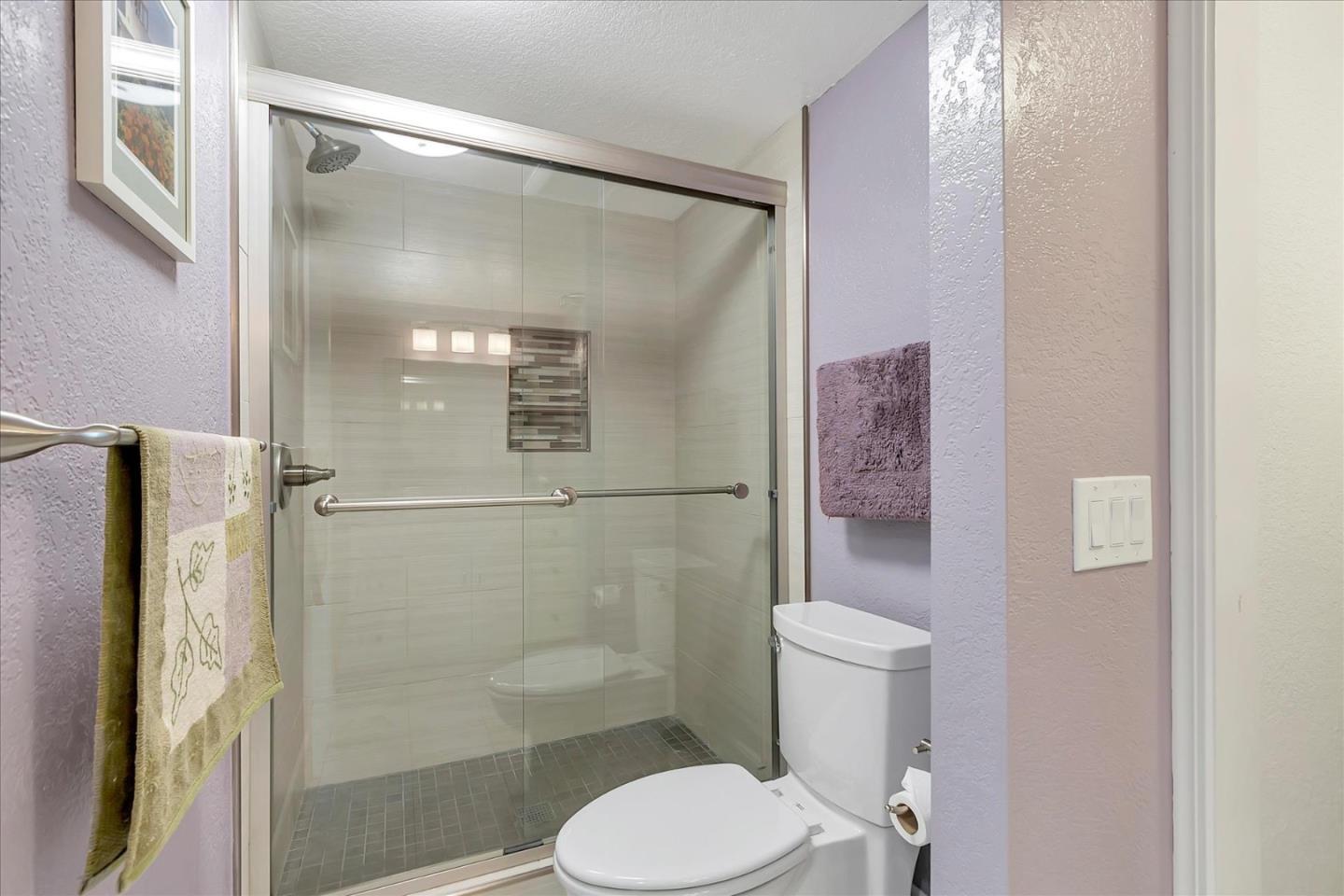 8387 Riesling Way San Jose, CA 95135 - Photo 25 of 52 a white toilet sitting next to a bathroom sink