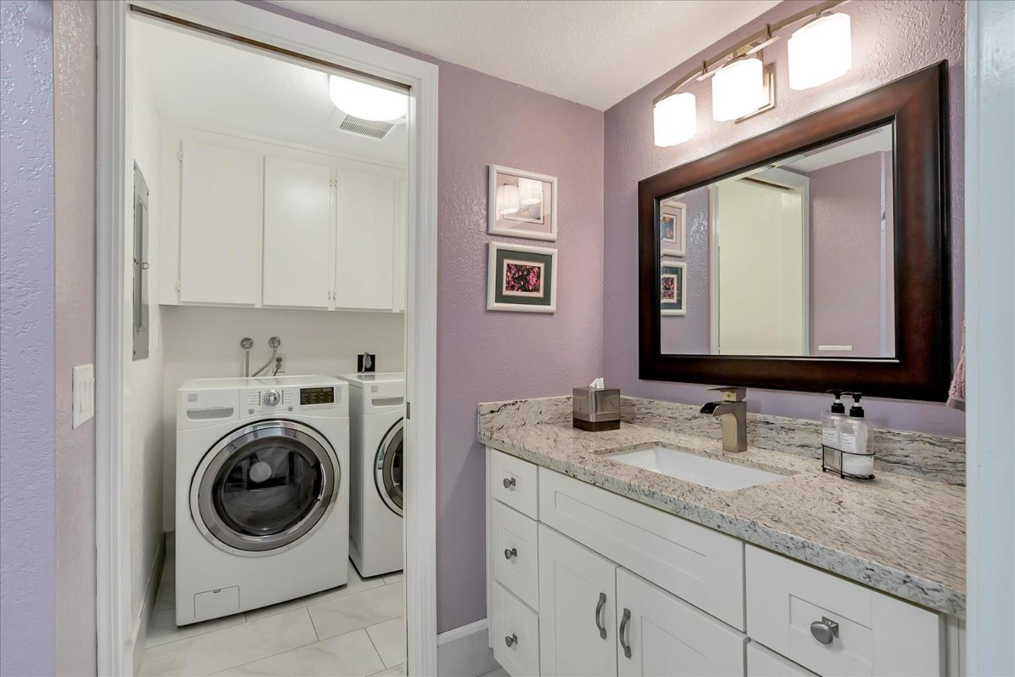8387 Riesling Way San Jose, CA 95135 - Photo 28 of 52 a bathroom with a granite countertop double vanity sink and a mirror