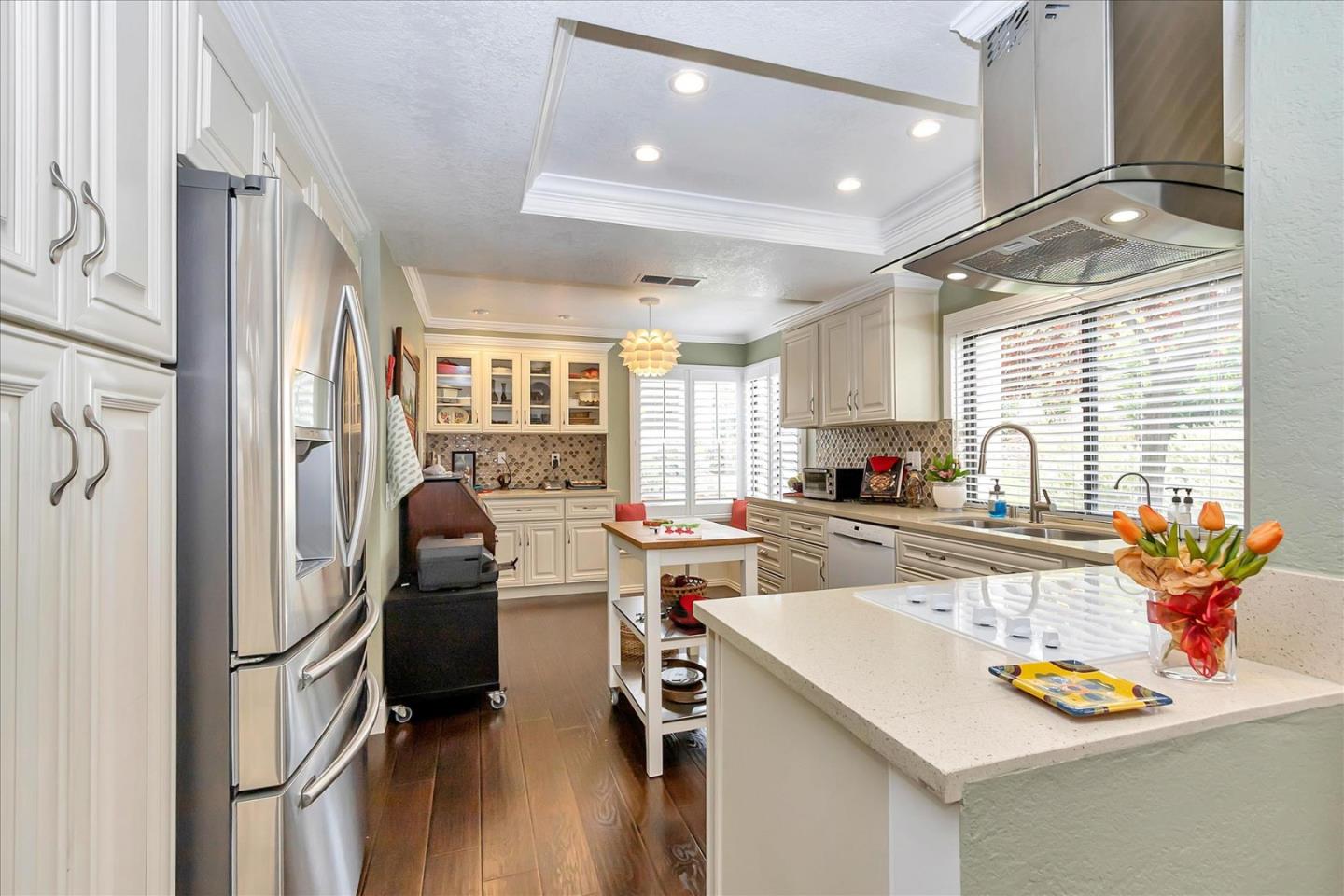 8387 Riesling Way San Jose, CA 95135 - Photo 3 of 52 a kitchen with stainless steel appliances granite countertop a refrigerator and a stove