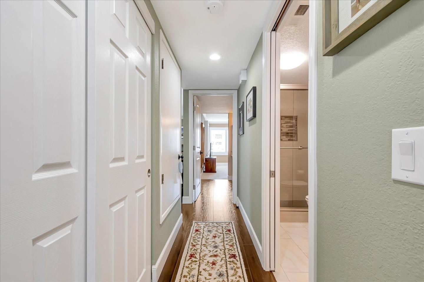 8387 Riesling Way San Jose, CA 95135 - Photo 34 of 52 a view of hallway with wooden floor
