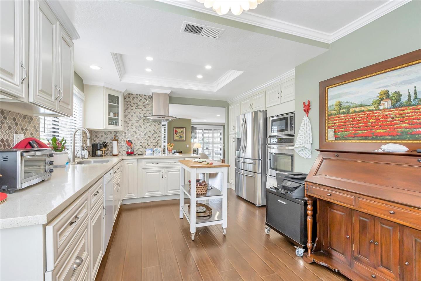 8387 Riesling Way San Jose, CA 95135 - Photo 4 of 52 a kitchen with a sink appliances and cabinets