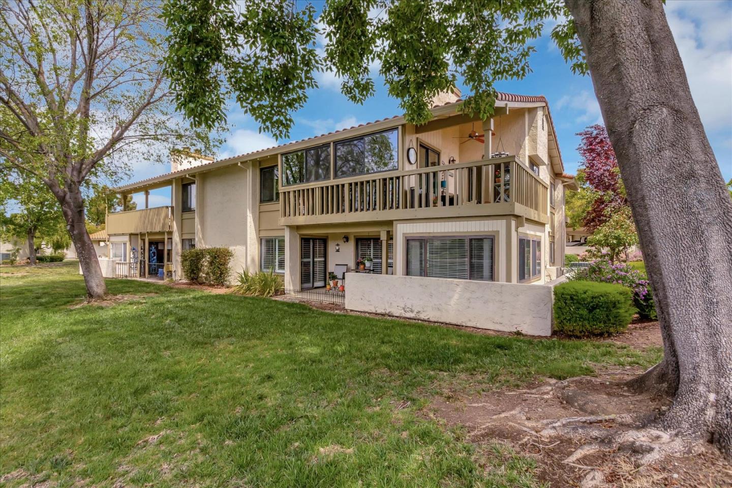 8387 Riesling Way San Jose, CA 95135 - Photo 43 of 52 a front view of a house with a garden and trees
