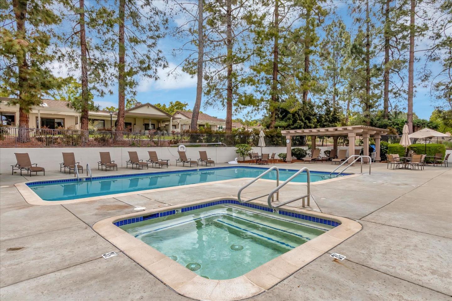 8387 Riesling Way San Jose, CA 95135 - Photo 46 of 52 a view of swimming pool with chairs and trees