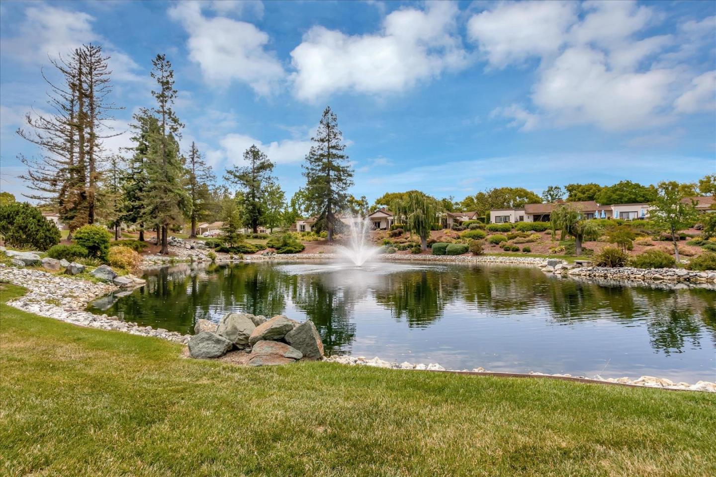 8387 Riesling Way San Jose, CA 95135 - Photo 49 of 52 a view of a lake with houses in the back