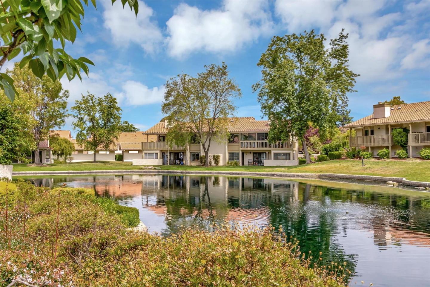 8387 Riesling Way San Jose, CA 95135 - Photo 51 of 52 a view of a lake with a house in the background