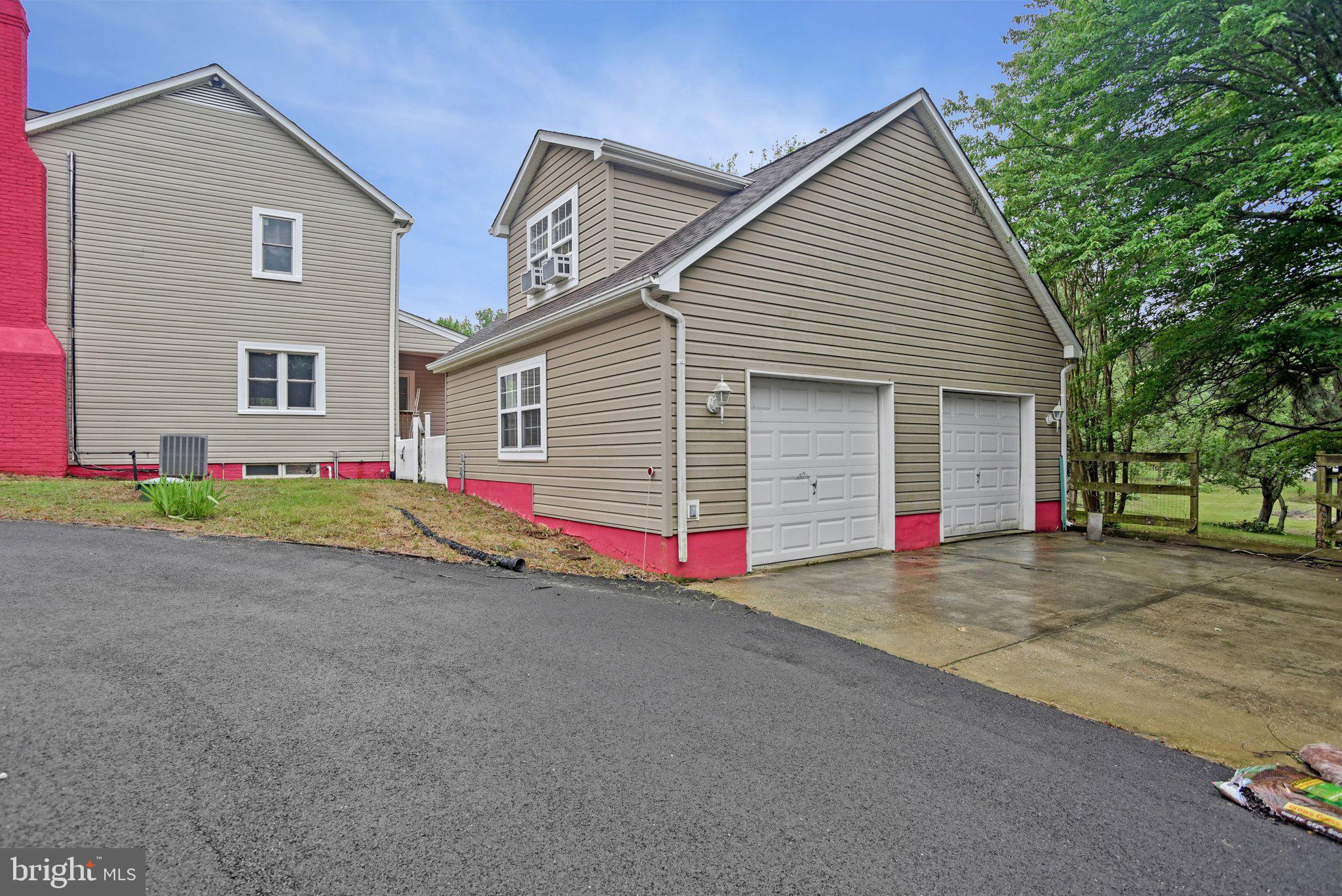 8965 Poorhouse Road Port Tobacco, MD 20677 - Photo 17 of 18 a view of yellow house with street