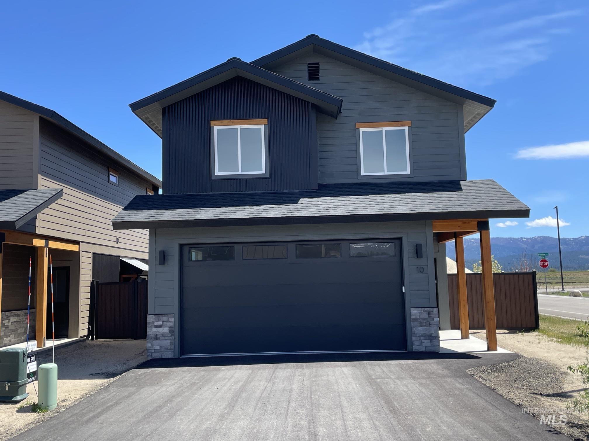 10 North Crk Way Cascade, ID 83611 - Photo 2 of 24 Contemporary exterior featuring a dark gray facade with contrasting ribbed metal siding