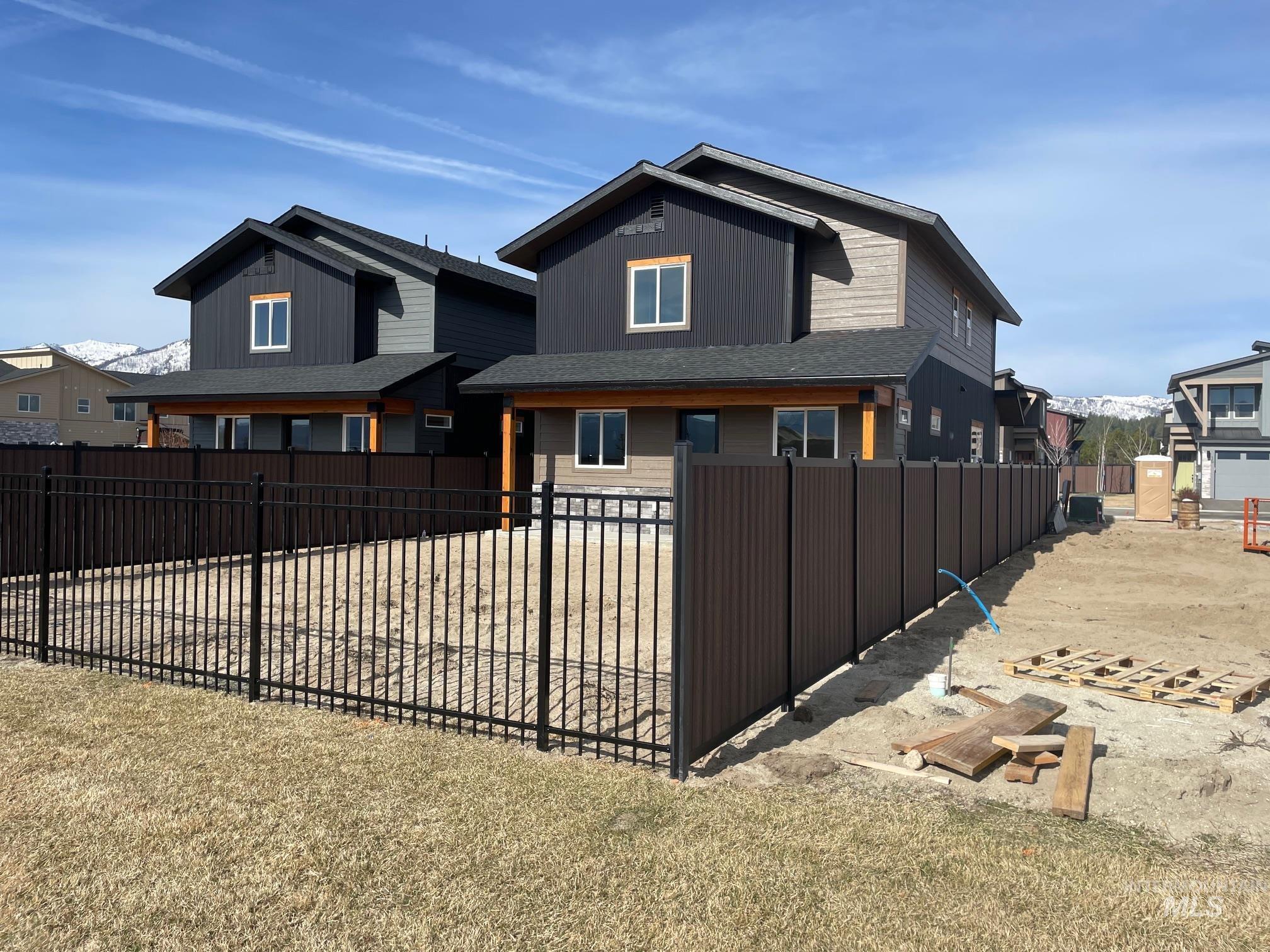 10 North Crk Way Cascade, ID 83611 - Photo 21 of 24 Rear view of property with a fenced front yard and board and batten siding
