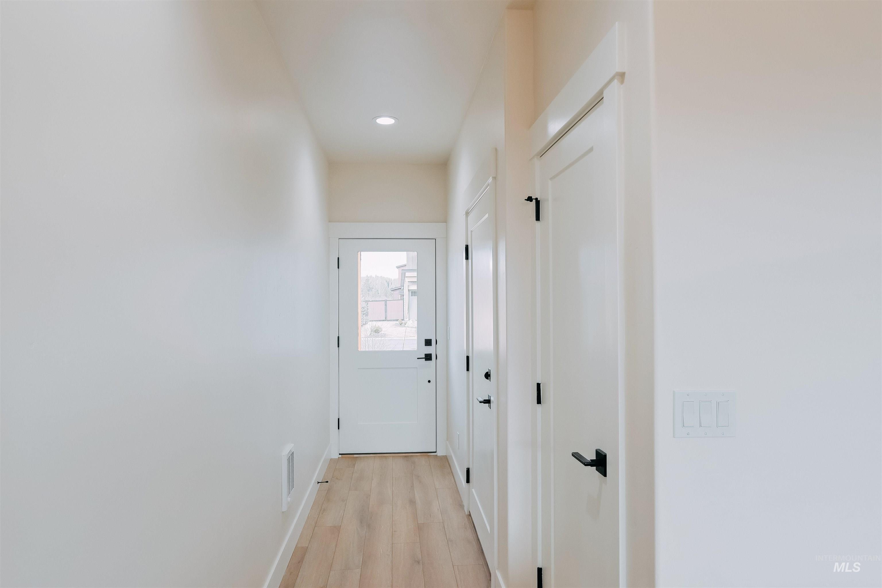 10 North Crk Way Cascade, ID 83611 - Photo 3 of 24 Doorway featuring wood finished floors and recessed lighting