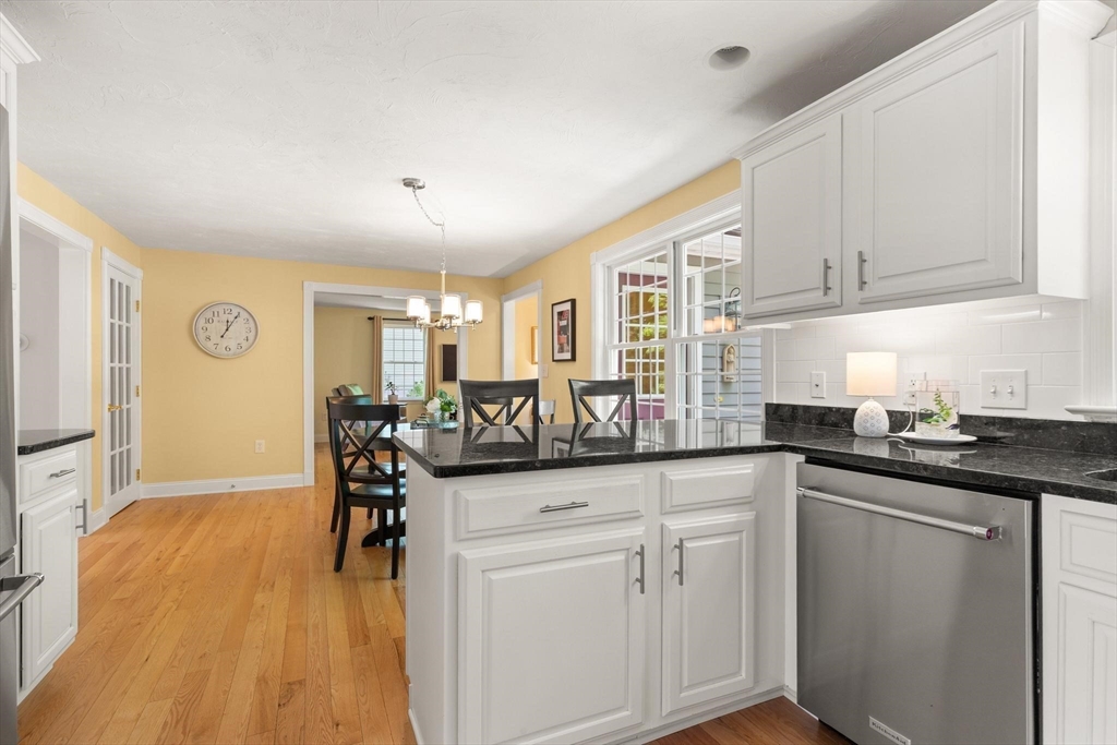 67 Bridle Path Franklin, MA 02038 - Photo 8 of 35 a kitchen with stainless steel appliances granite countertop a sink and cabinets