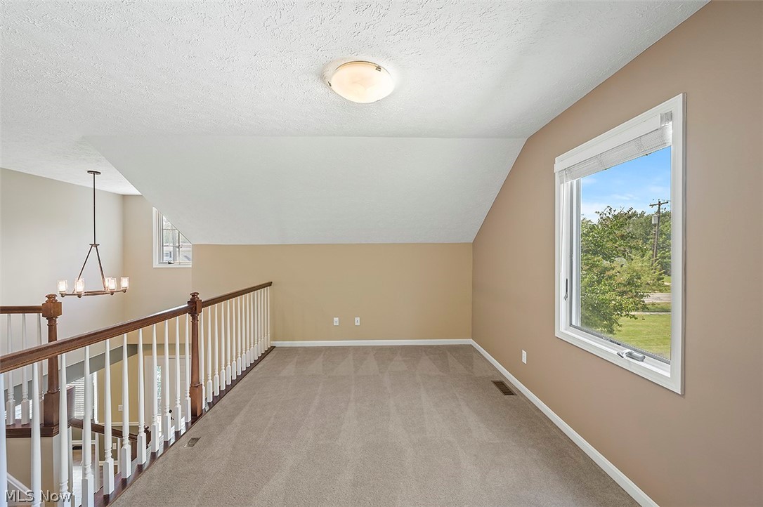 4501 Jaycox Road Avon, OH 44011 - Photo 19 of 32 Heading upstairs celebrates a 300 sq ft loft with picture window
