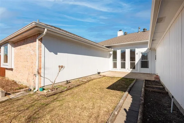 a view of a backyard of a house