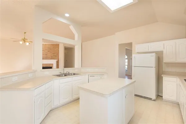 a spacious bathroom with a double vanity sink a mirror and a shower