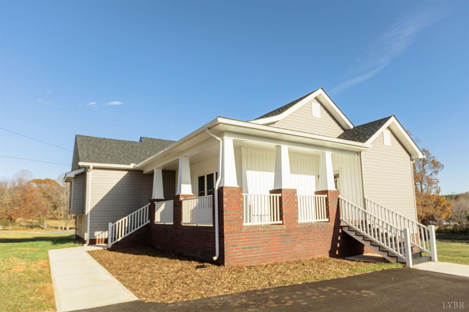 245 Country Estates Road Appomattox, VA 24522 - Photo 3 of 41 a front view of a house with a yard