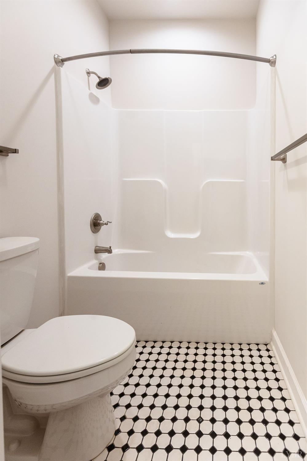 245 Country Estates Road Appomattox, VA 24522 - Photo 26 of 41 a bathroom with a bathtub and a toilet
