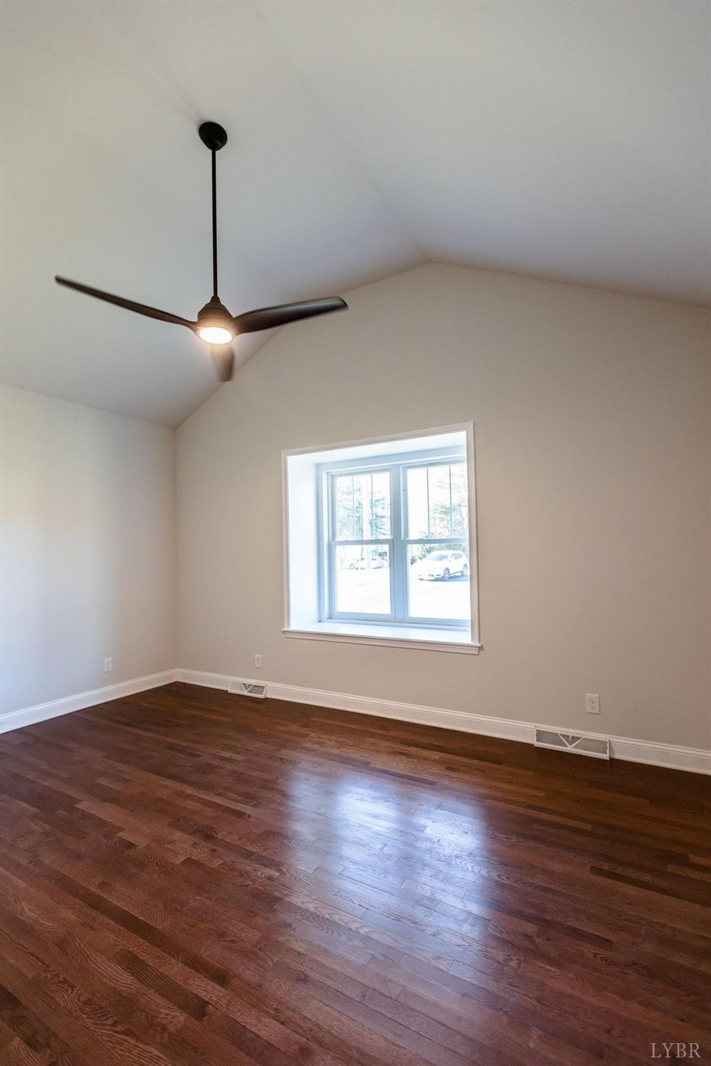 245 Country Estates Road Appomattox, VA 24522 - Photo 29 of 41 a view of an empty room with window and a chandelier