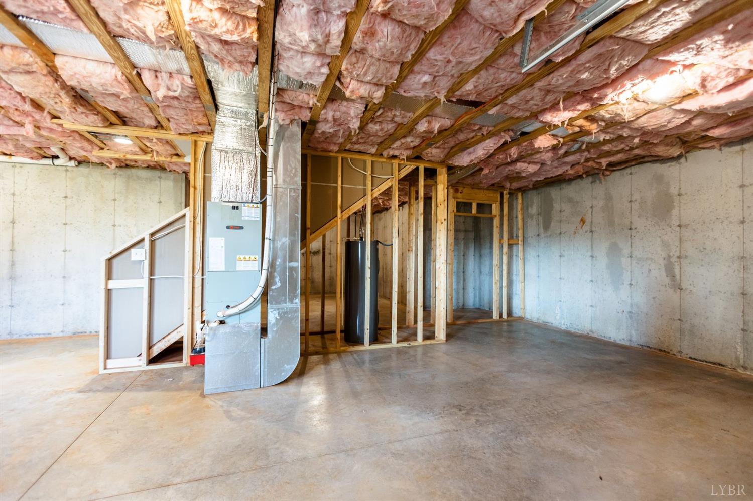 245 Country Estates Road Appomattox, VA 24522 - Photo 34 of 41 a view of an empty room with wooden walls and stairs