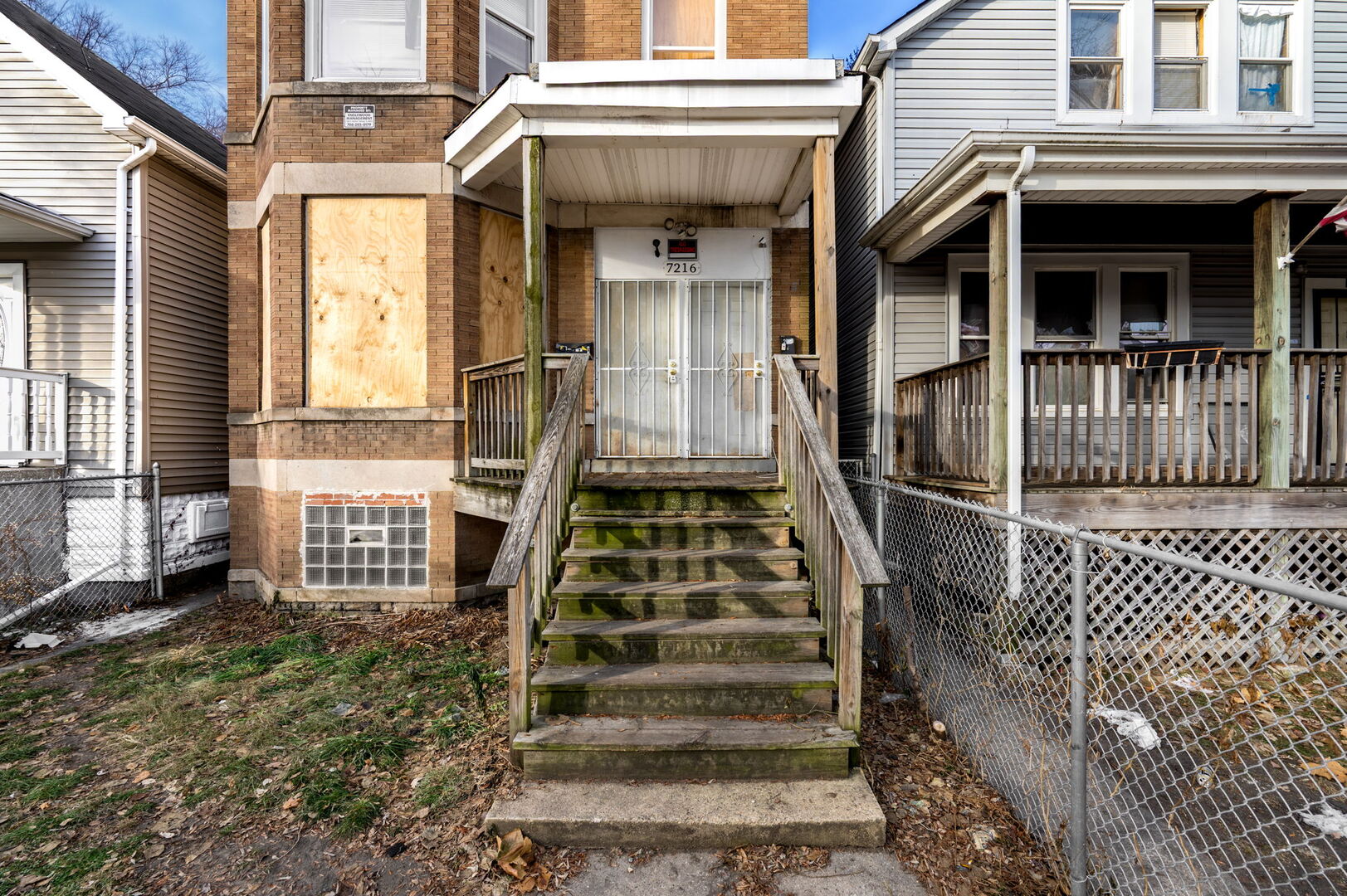 7216 South Green Street Chicago, IL 60621 - Photo 17 of 19 front view of a house with a large window