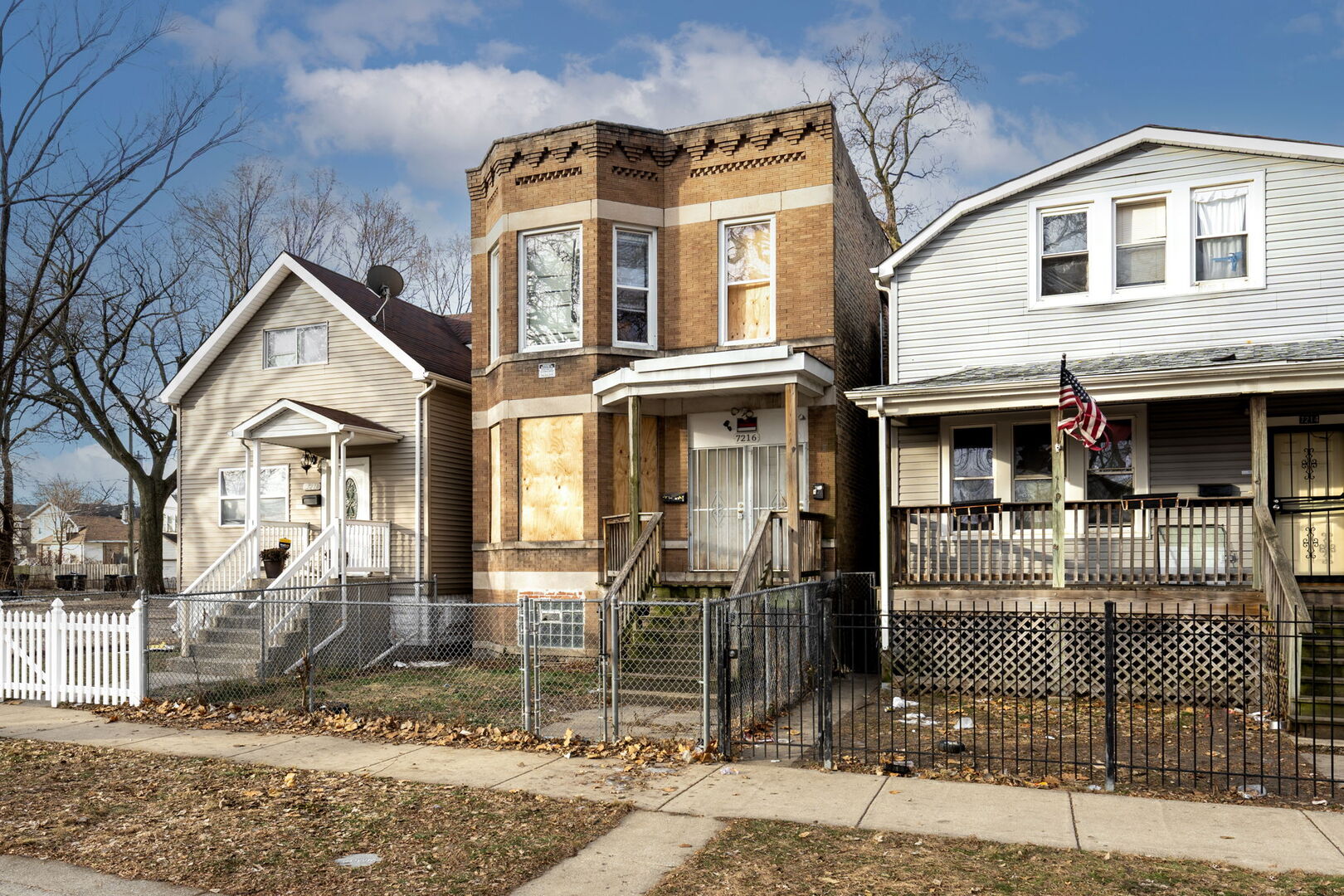 7216 South Green Street Chicago, IL 60621 - Photo 18 of 19 a front view of a house with iron fence