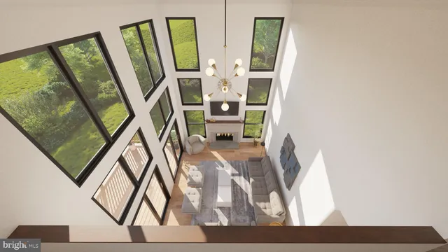 a view of living room with furniture and mirror