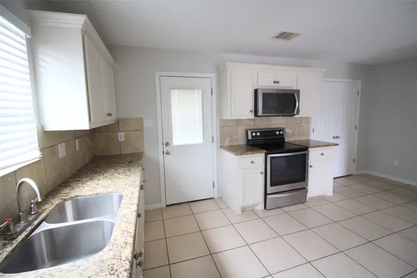 a view of a back yard from a porch